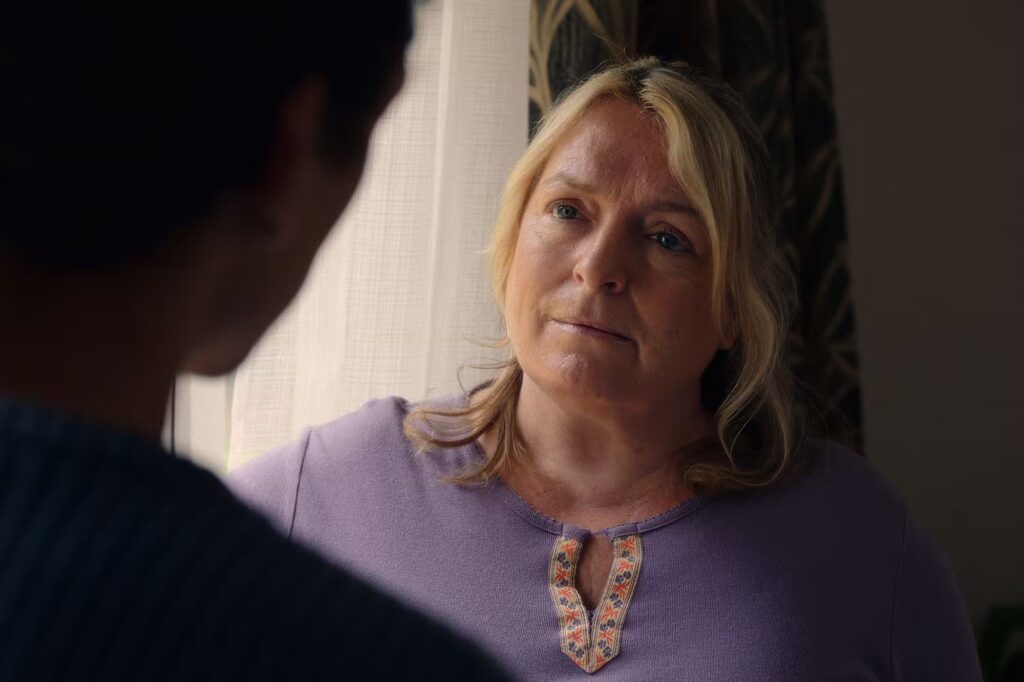 Blonde woman looking at a man