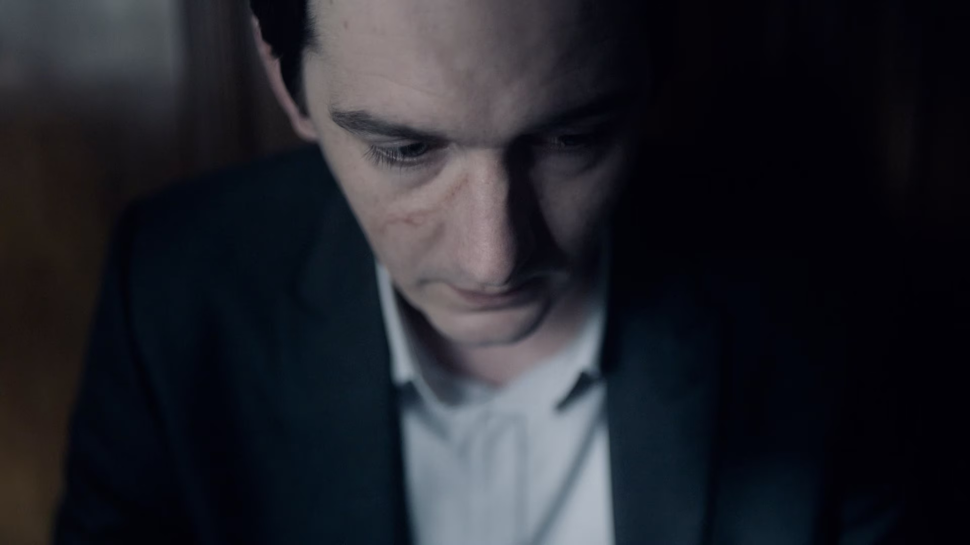 Close-up of a man’s face showing a concerned expression.